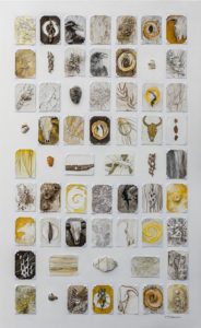 Mixed media art with a grid of small works on a larger canvas. The small pieces follow a southwest theme and use found materials from the desert and more. Artwork by Michigan artist Taryn Okesson