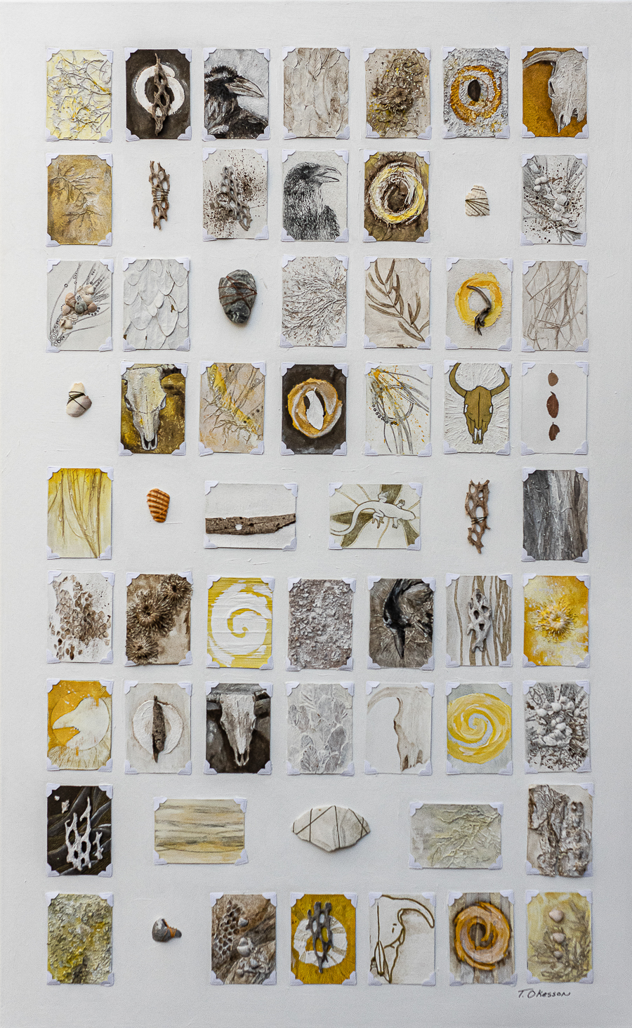 Mixed media art with a grid of small works on a larger canvas. The small pieces follow a southwest theme and use found materials from the desert and more. Artwork by Michigan artist Taryn Okesson