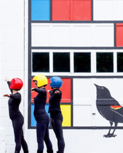 TaMaMa Dance Company performing in front of the Mondrian Garage Mural on Third Street in Marquette MI for Artweek.