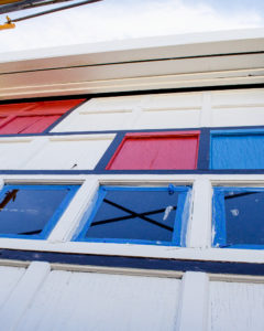 Mid-progress of mural project. Marquette artist Taryn Okesson shows a different angle of the mural progress. Mondrian Garage Mural Third Street, Marquette, MI.
