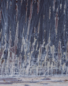 Process shot of the Mondrian Garage Mural Creation. Detail of the textured, chipping, peeling veneer wood. Mondrian Garage Mural Third Street, Marquette, MI.