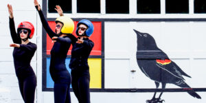 TaMaMa Dance Company performing in front of the Mondrian Garage Mural on Third Street in Marquette MI for Artweek.