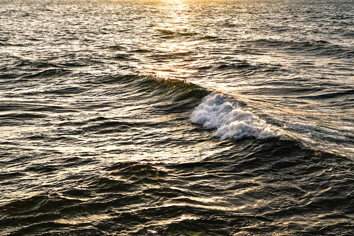 Lake Superior reflecting the sunset in Marquette MI, Photography by Marquette Artist, Visual Artist, Artist, Taryn Okesson.